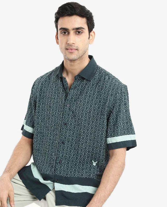Men's Stain-Resistant Shirts for Mess-Free WearRare Rabbit Men's Zubi Dark Green Viscose Fabric Short Sleeve Boxy Fit Monogram Print Shirt Men's Stain-Resistant Shirts for Mess-Free WearRare Rabbit Men's Zubi Dark Green Viscose Fabric Short Sleeve Boxy Fit Monogram Print Shirt